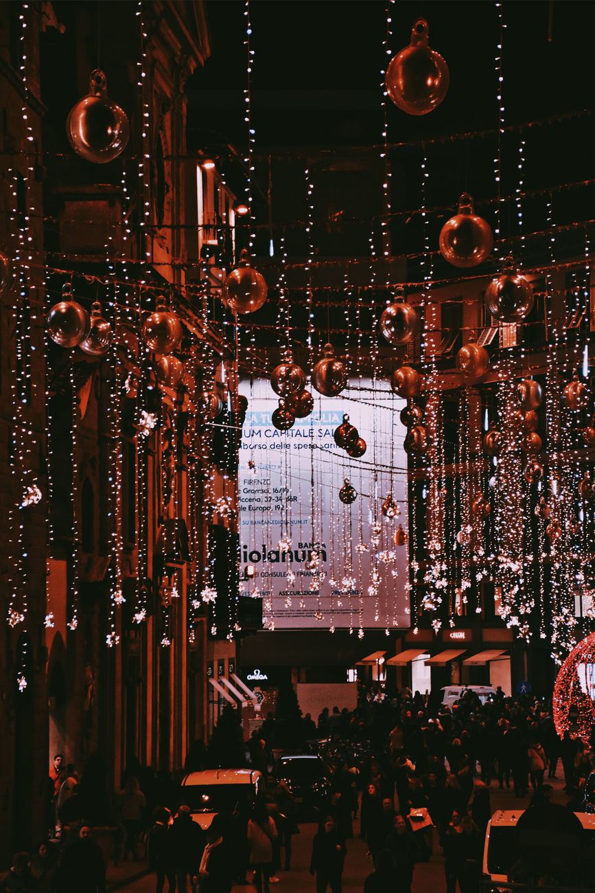 christmas decoration hanging above a street