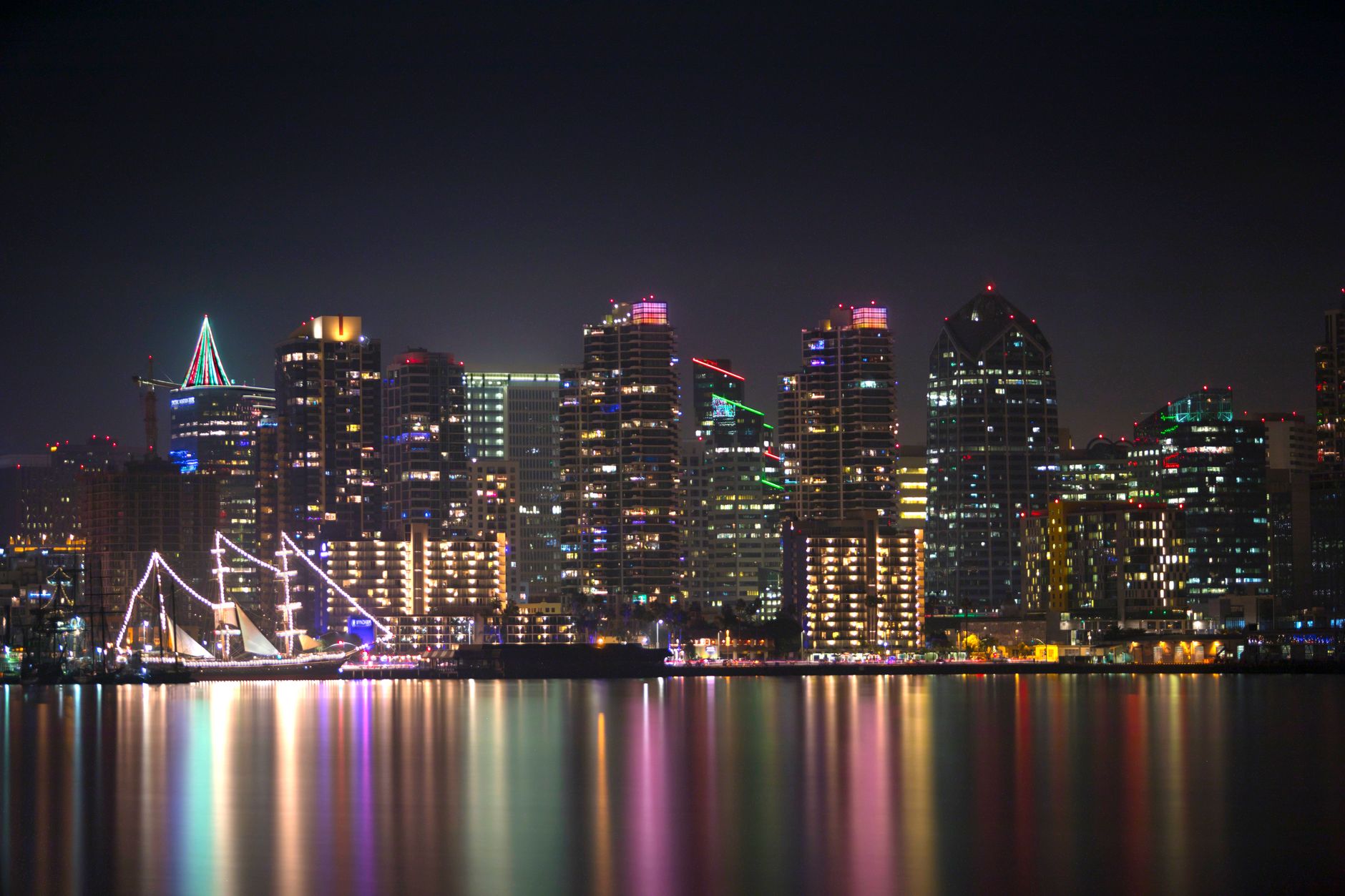 nighttime skyline of san diego reflected on water